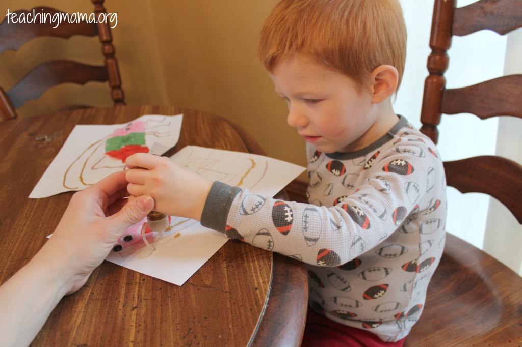 Using glitter glue- great for fine motor skills