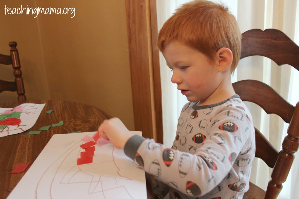 Laying down tissue paper- great for fine motor skills