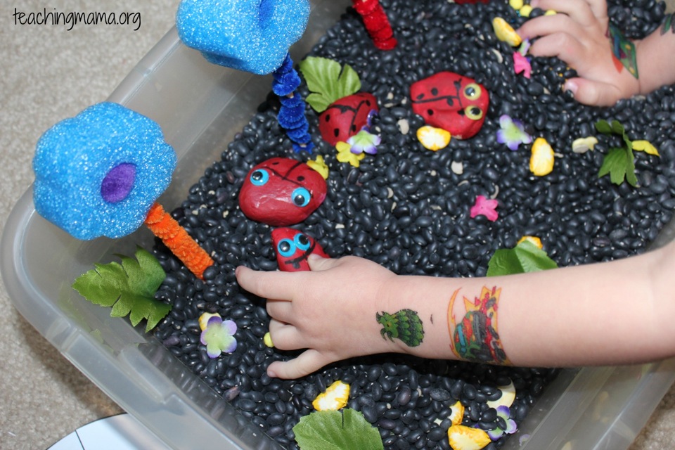 playing with the sensory bin