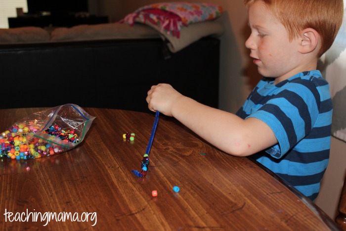 threading beads on a pipe cleaner