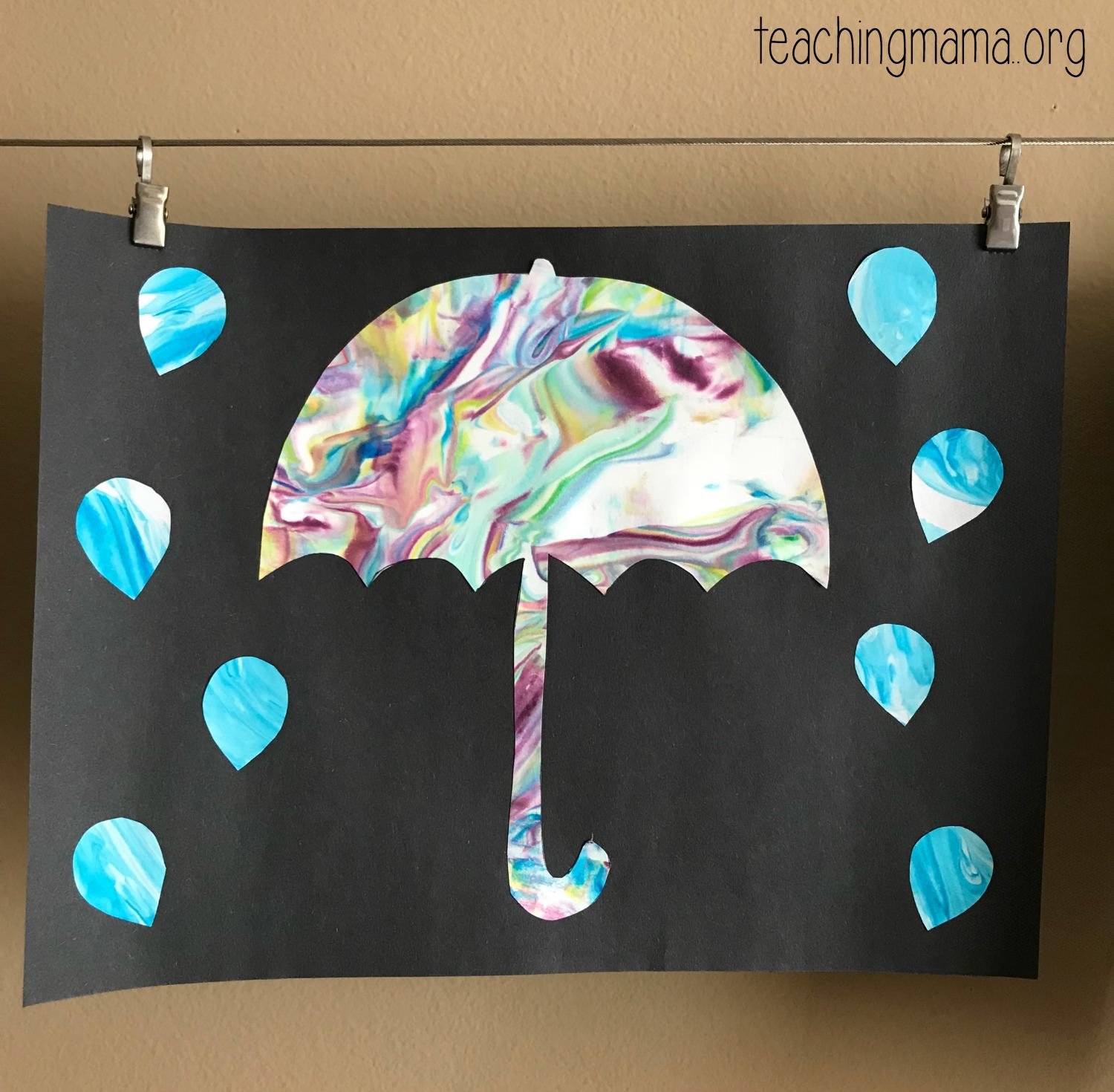 umbrella craft using construction paper, shaving cream, and paint.