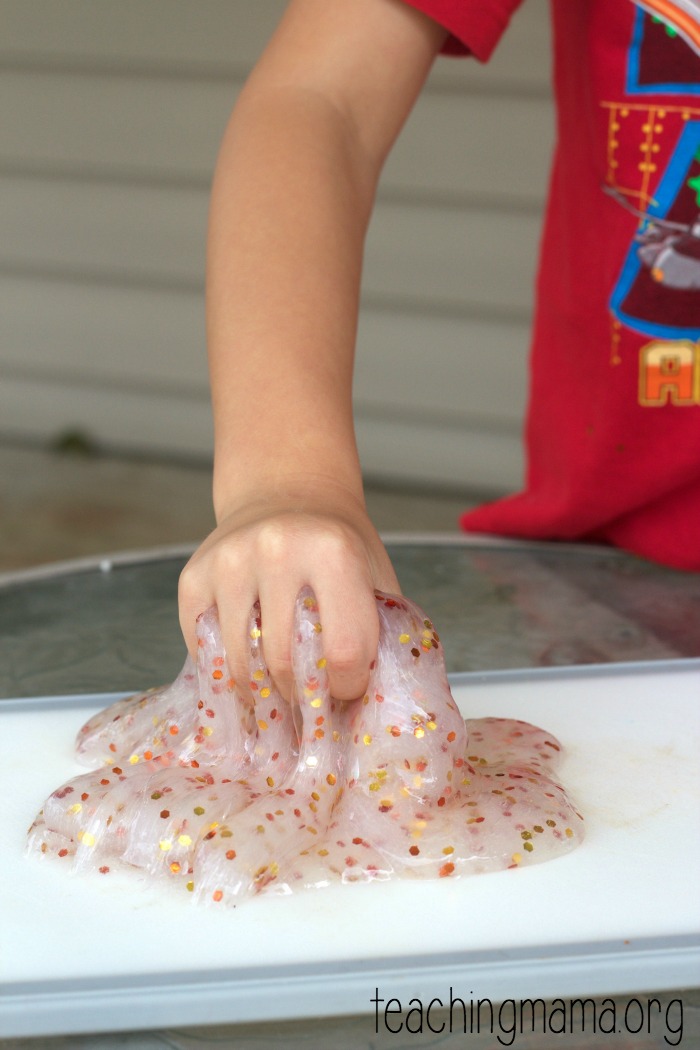 I made DIY Galaxy slime out of Sta-Flo liquid starch, clear Elmers glue,  and three different colors of extra fine glitter. …