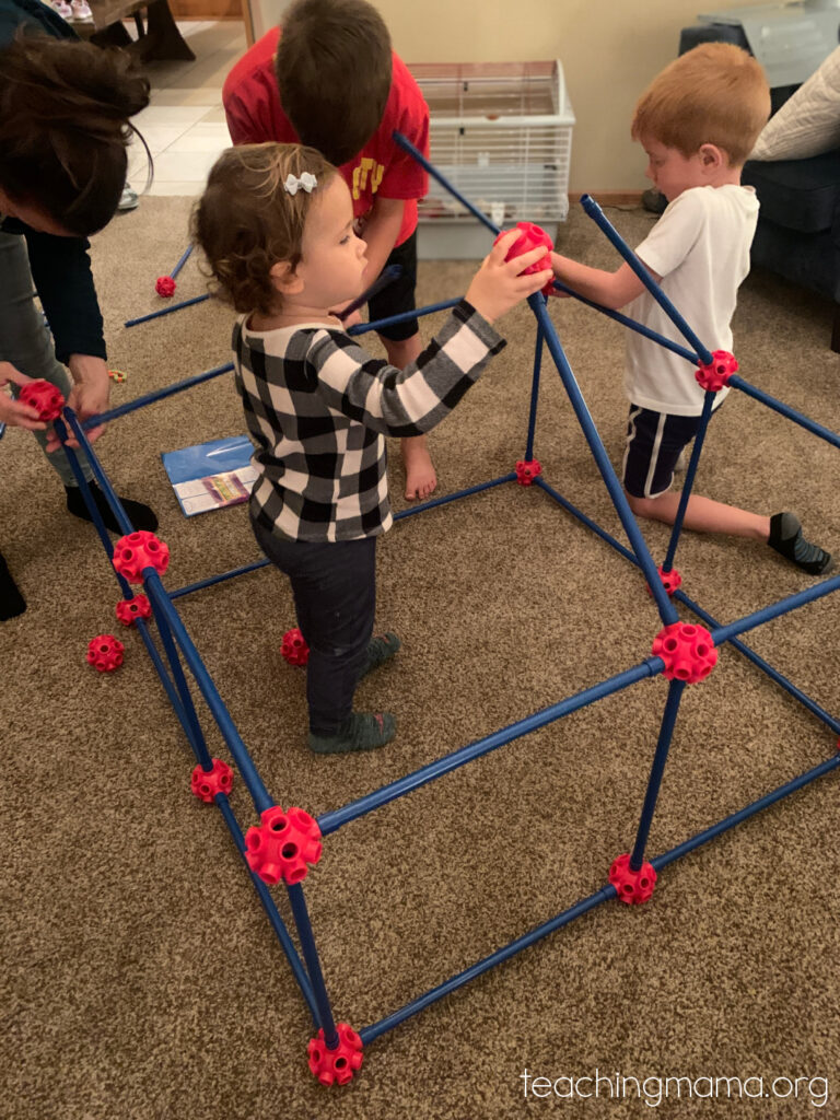 toddler building fort