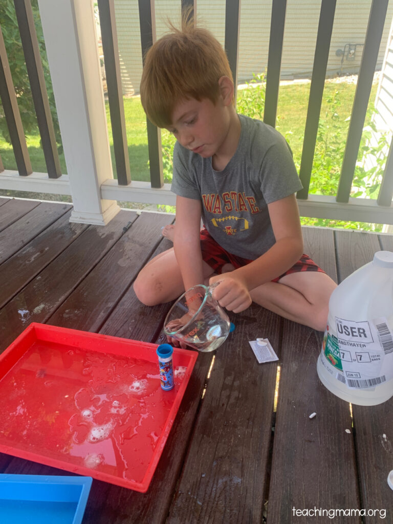 pouring vinegar into rocket