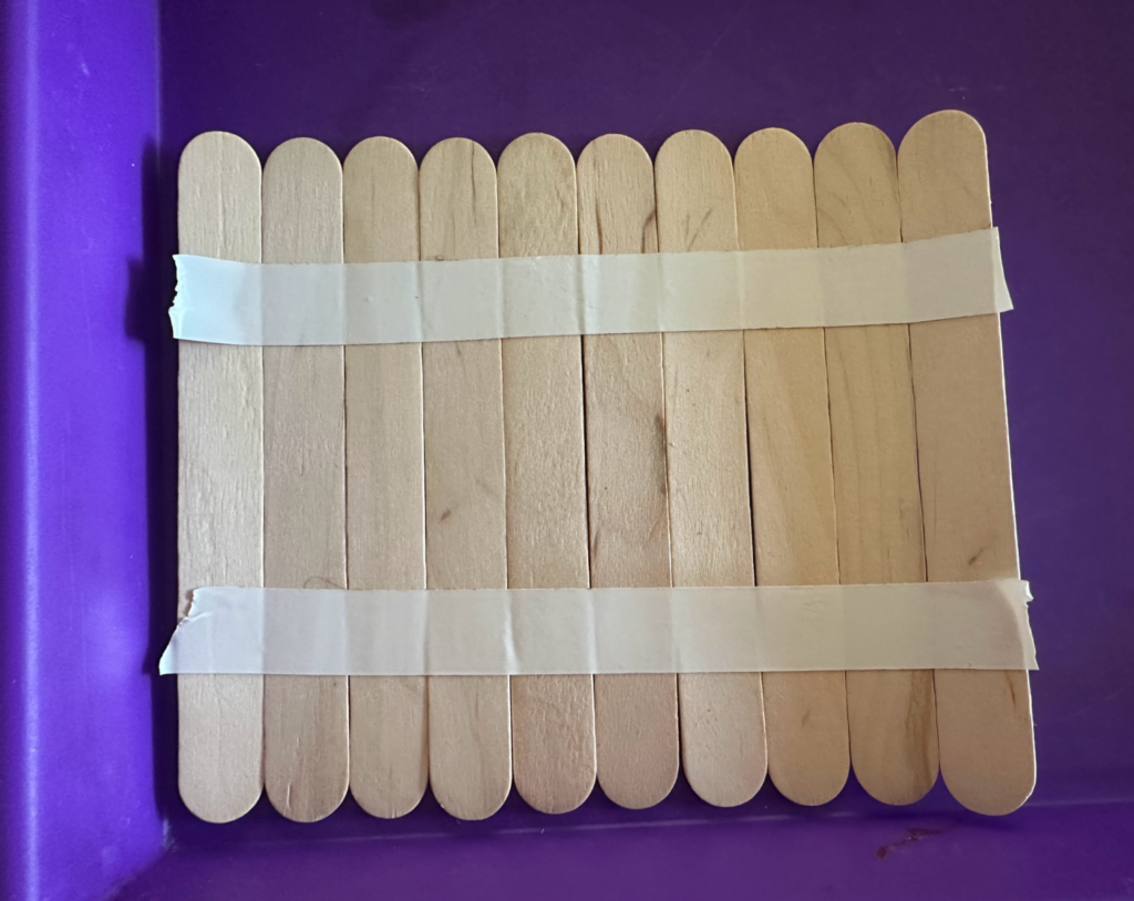 taped craft sticks together
