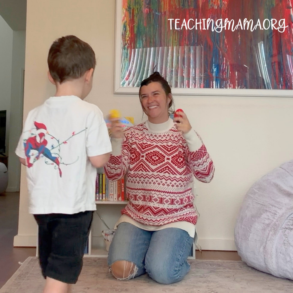 Mom and son singing and dancing to christmas songs